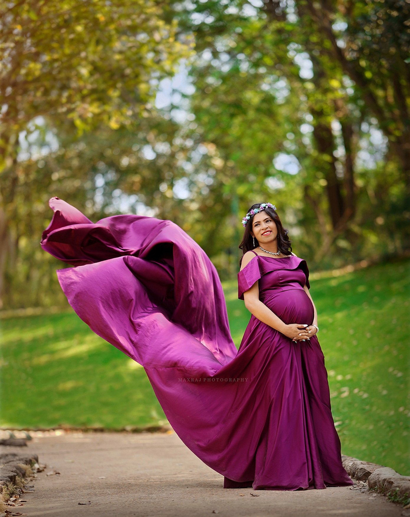 Maternity photoshoot of Pregnant woman in pune in purple flowing gown , maternity photoshoot poses , best maternity photoshoot ideas