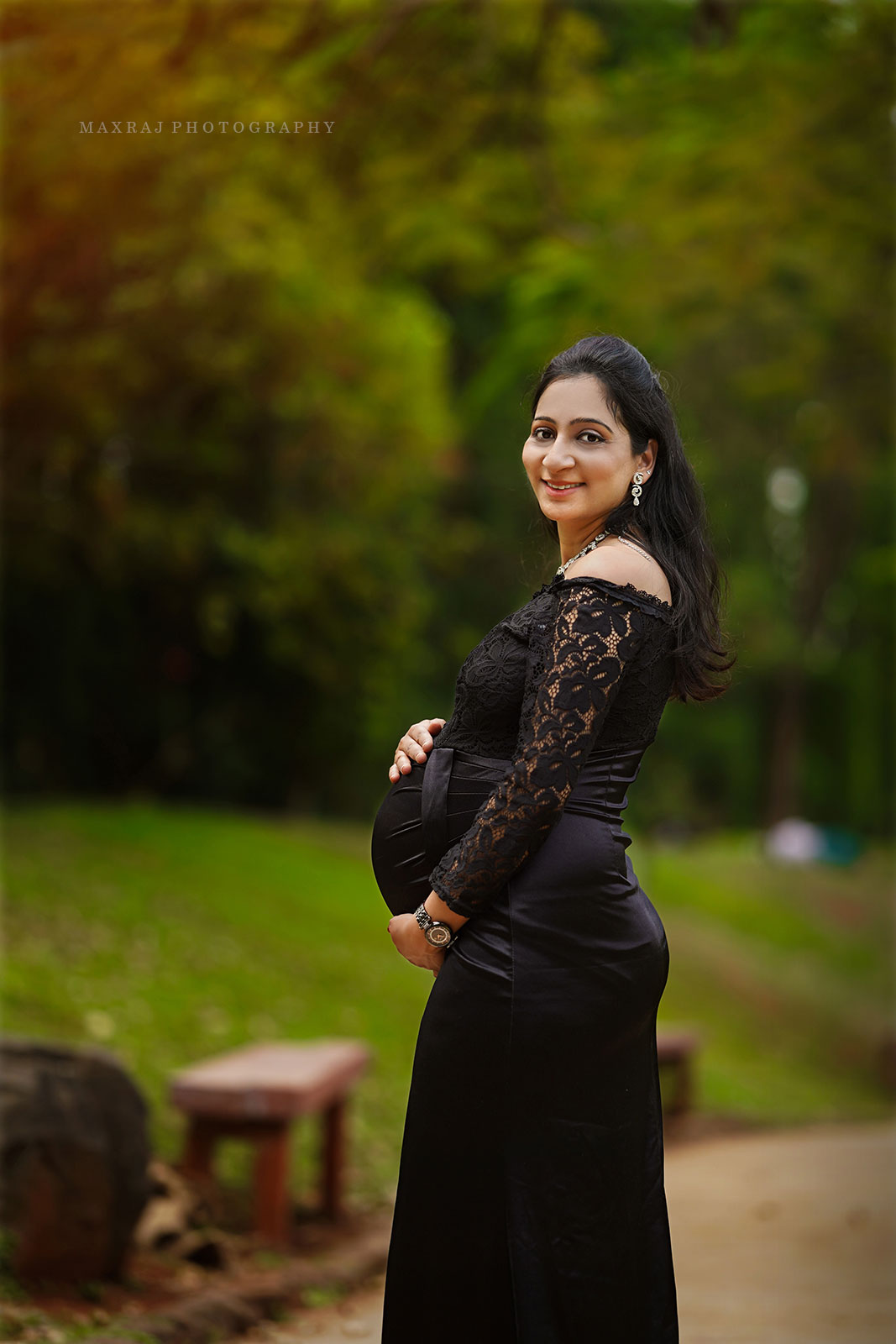 maternity photoshoot of pregnant lady in black gown in pune