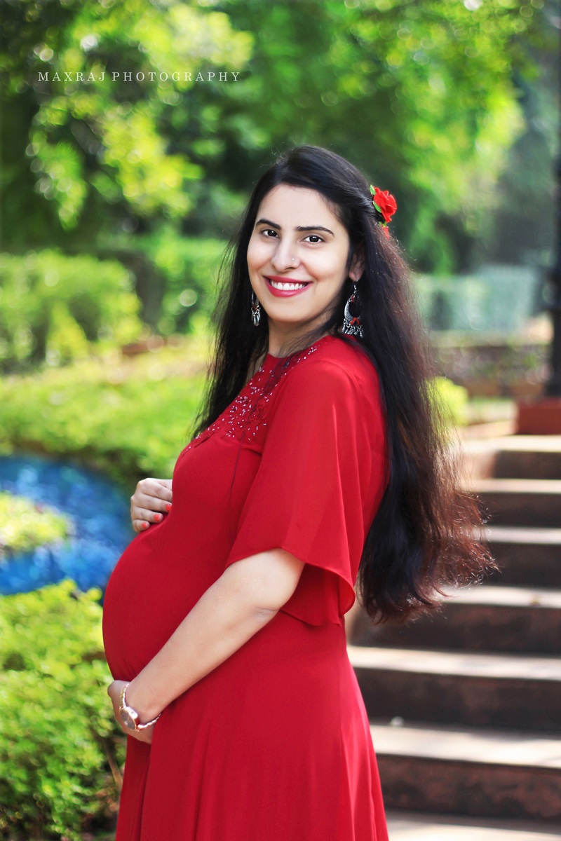 best maternity photographer in pune, maternity photoshoot in red gown in pune city